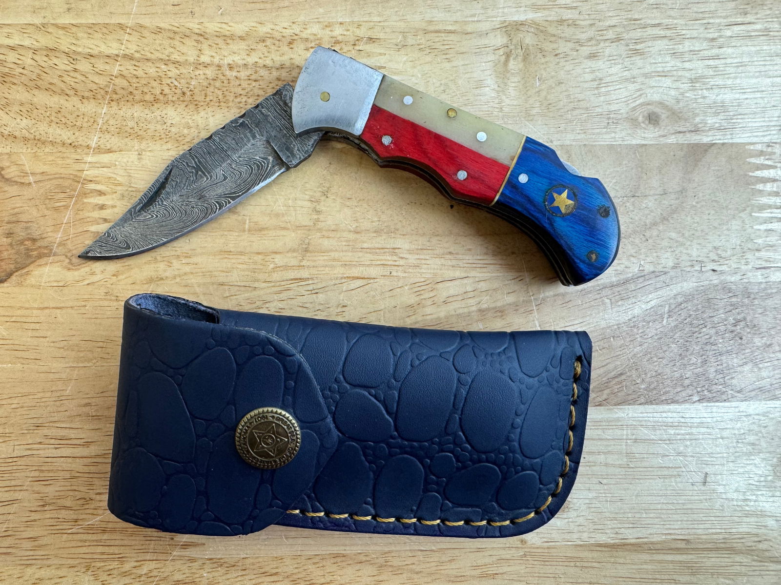 Beautiful Handmade Damascus Steel Folding Knife w/Sheath: Beautiful Handmade Damascus Steel Folding Knife w/Sheath. See photos for details and measurements. Meticulously crafted by skilled artisans, each knife is forged from multiple layers of high-carbon st