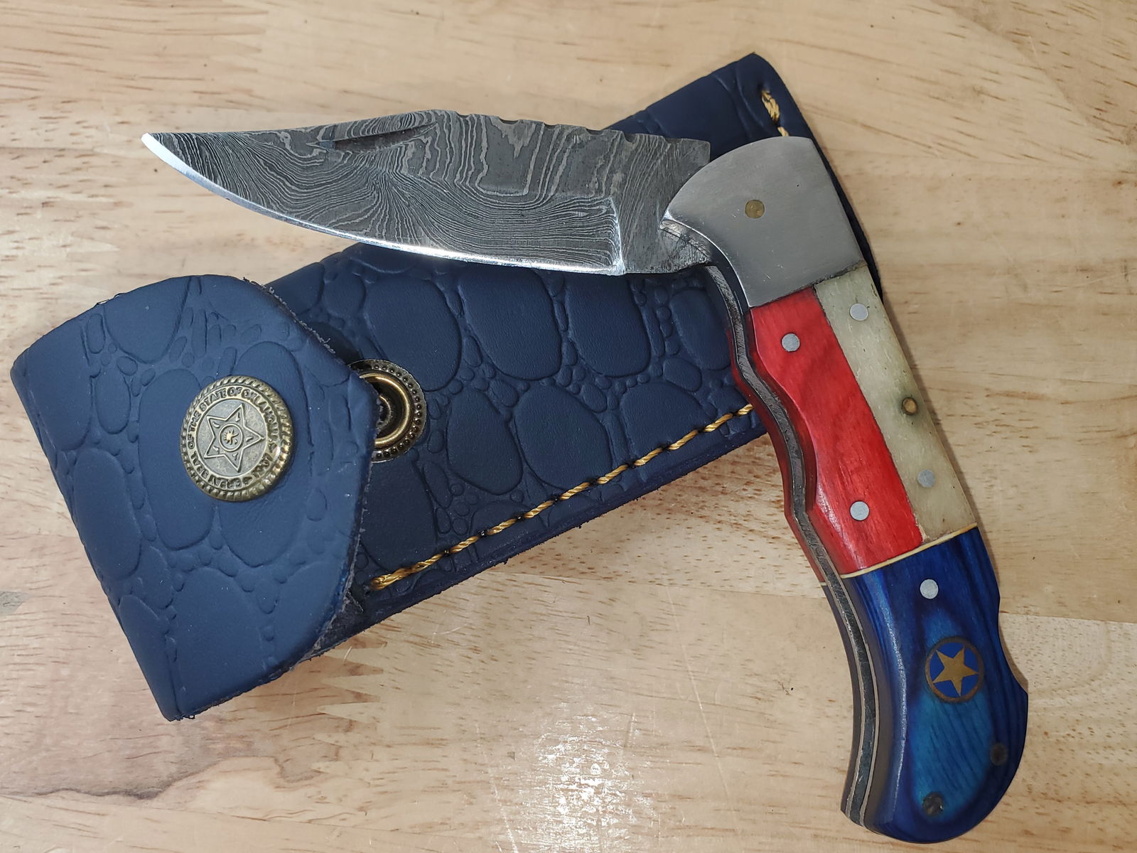 Beautiful Handmade Damascus Steel Folding Knife w/Sheath: Beautiful Handmade Damascus Steel Folding Knife w/Sheath. See photos for details and measurements. Meticulously crafted by skilled artisans, each knife is forged from multiple layers of high-carbon st
