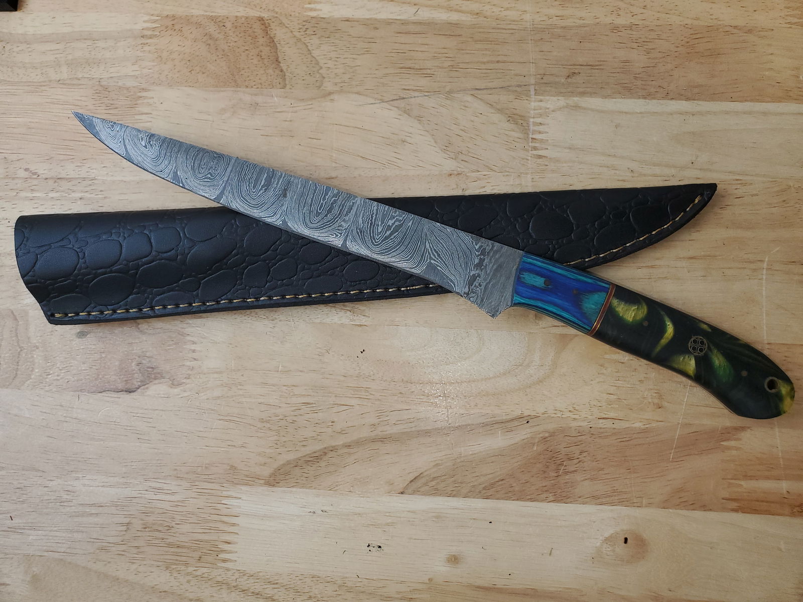 Beautiful Handmade Damascus Steel Filet Knife w/Sheath: Beautiful Handmade Damascus Steel Filet Knife w/Sheath. See photos for details and measurements. Meticulously crafted by skilled artisans, each knife is forged from multiple layers of high-carbon stee