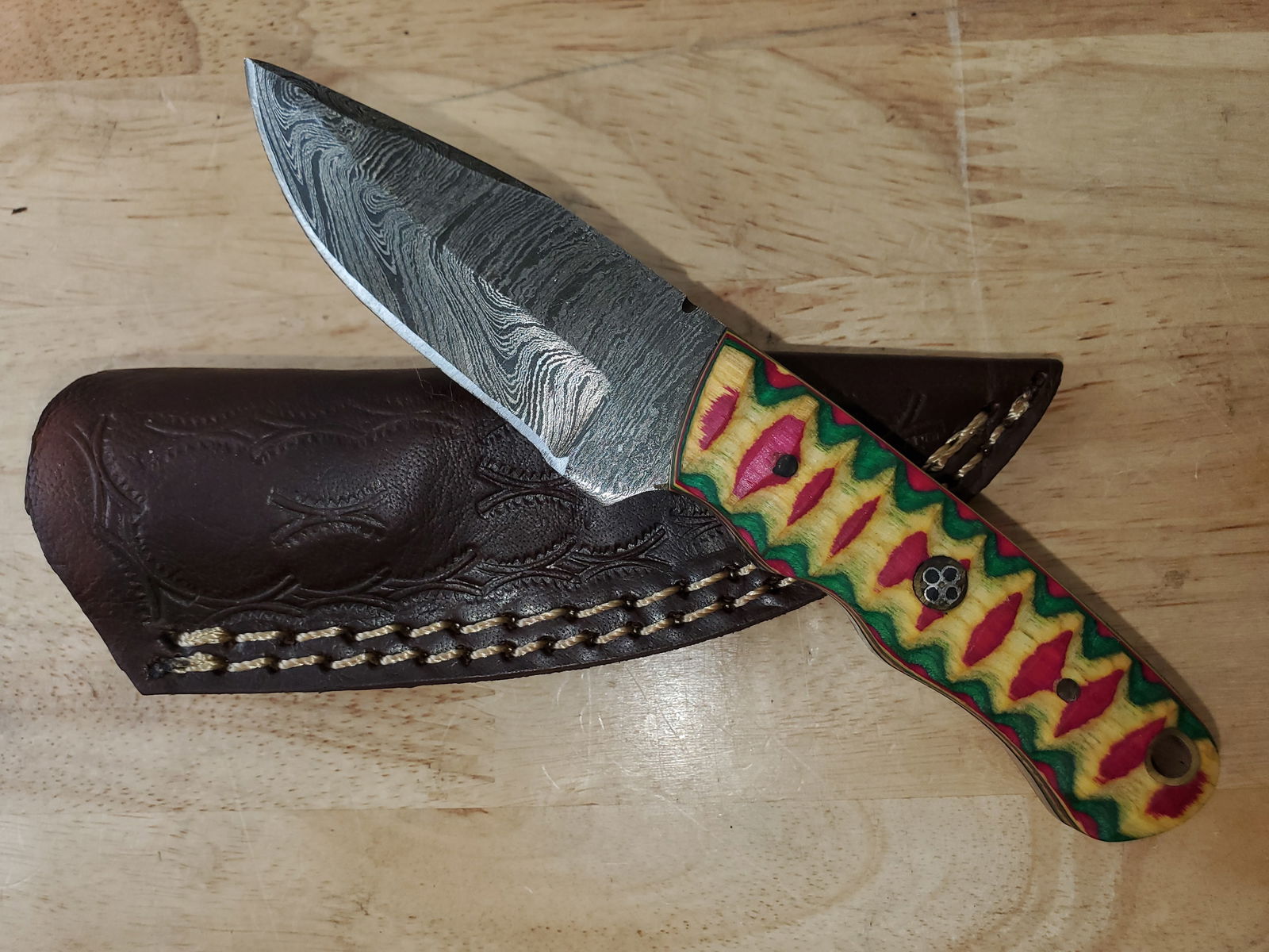 Beautiful Handmade Damascus Steel Knife w/Sheath: Beautiful Handmade Damascus Steel Knife w/Sheath. See photos for details and measurements. Meticulously crafted by skilled artisans, each knife is forged from multiple layers of high-carbon steel?heat