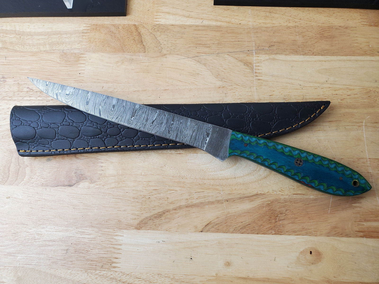 Beautiful Handmade Damascus Steel Filet Knife w/Sheath: Beautiful Handmade Damascus Steel Filet Knife w/Sheath. See photos for details and measurements. Meticulously crafted by skilled artisans, each knife is forged from multiple layers of high-carbon stee