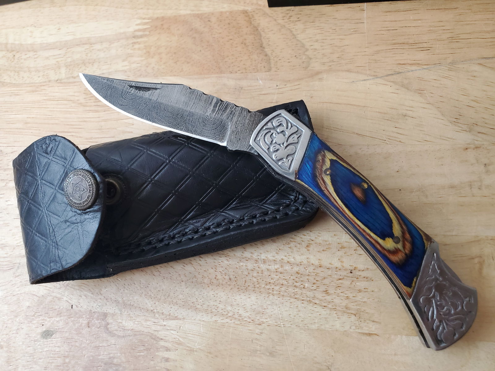 Beautiful Handmade Damascus Steel Folding Knife w/Sheath: Beautiful Handmade Damascus Steel Folding Knife w/Sheath. See photos for details and measurements. Meticulously crafted by skilled artisans, each knife is forged from multiple layers of high-carbon st