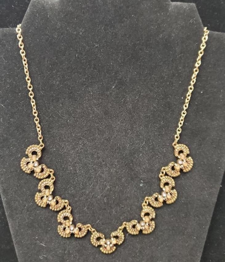 Gold Tone Necklace with Linked filigree Style Pendants accented with Shimmering Stones: Gold Tone Necklace with Linked filigree Style Pendants accented with Shimmering Stones