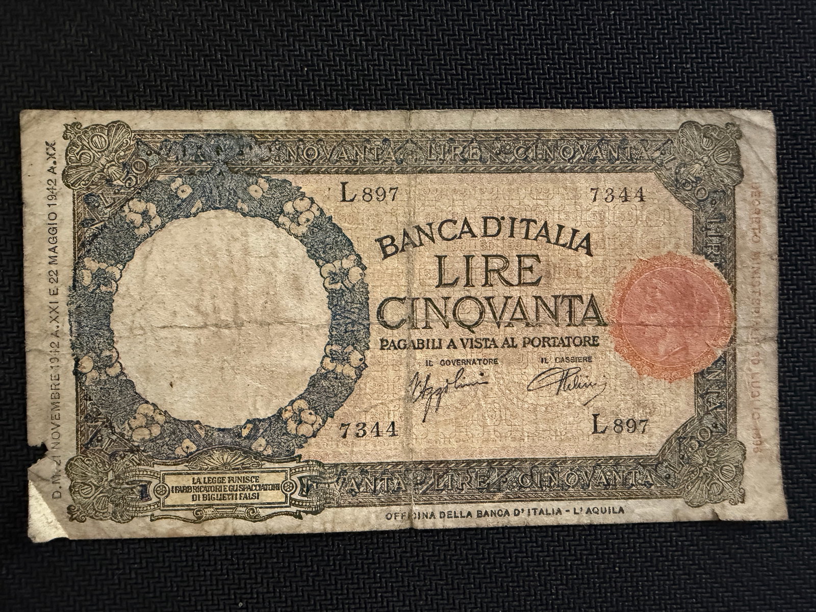 Vintage 50 Italian Lira Banknote - 1942 - WWII - Rare: Vintage 50 Italian Lira Banknote - 1942 - WWII - Rare. Bank and Series: Issued by the Banca d'Italia during the reign of King Vittorio Emanuele III. The front features a large floral wreath watermark 