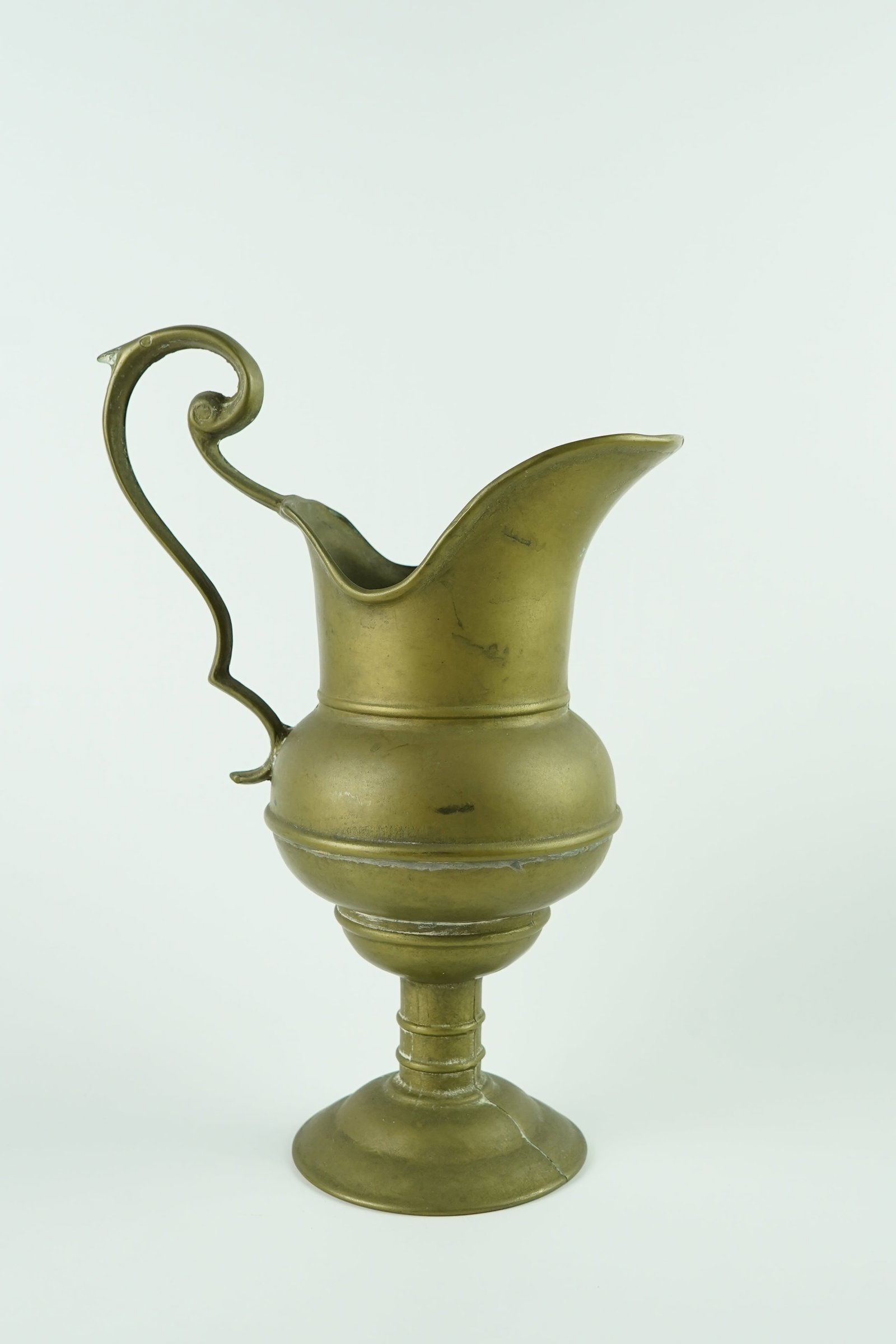 Antique Bronze 10" European Jug Pitcher: Believed to be from the 1800's. Beautifully crafted and designed. Great item for display on a mantle or throughout the house. Shows a wonderful patina for its age but in perfect condition