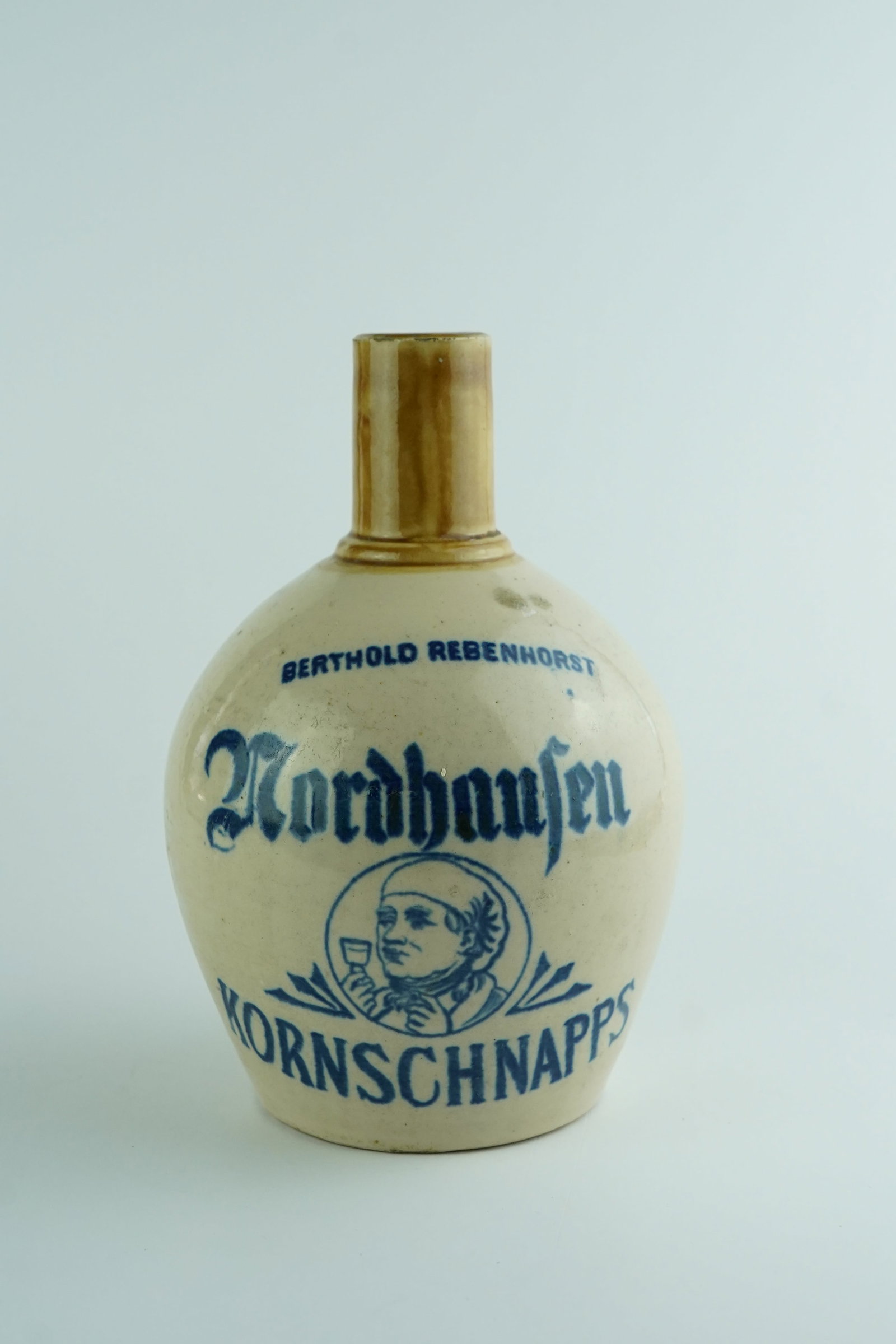 Antique Berthold Nordhausen Kornschnapps Stoneware Advertising Jug: Wonderful condition of the stoneware with no chips or imperfections. Beautiful blue stenciling makes this a great looking old vessel