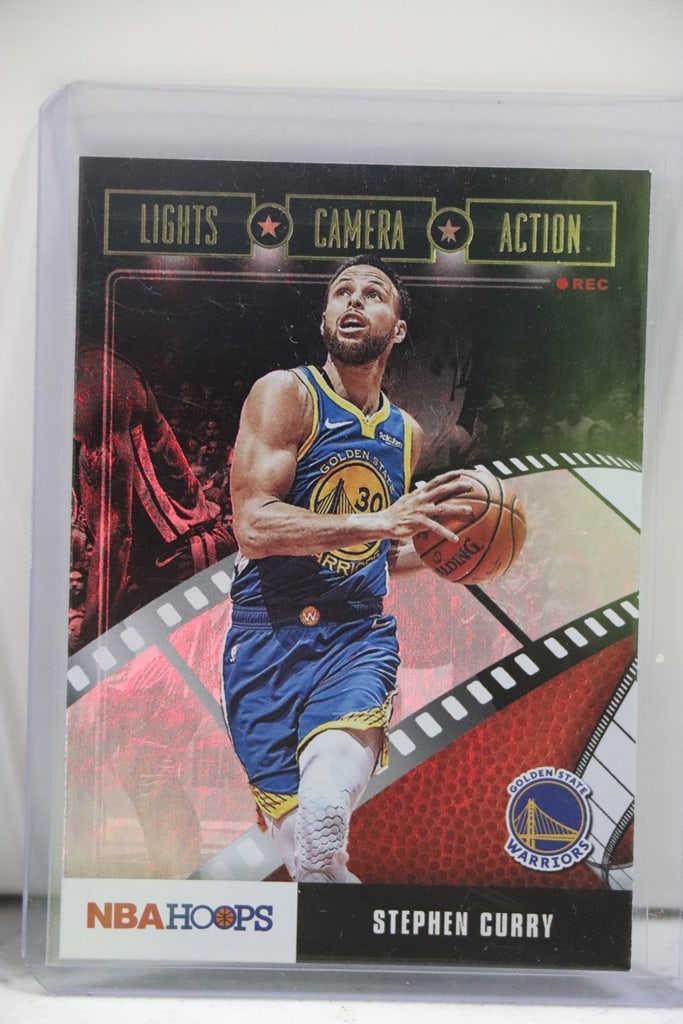 STEPHEN CURRY 2019-20 HOOPS LIGHTS CAMERA ACTION HOLOFOIL: NEAR MINT OR BETTER CONDITION 