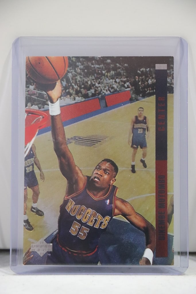 DIKEMBE MUTOMBO 1993-94 UPPER DECK BEHIND THE GLASS INSERT: NEAR MINT OR BETTER CONDITION 