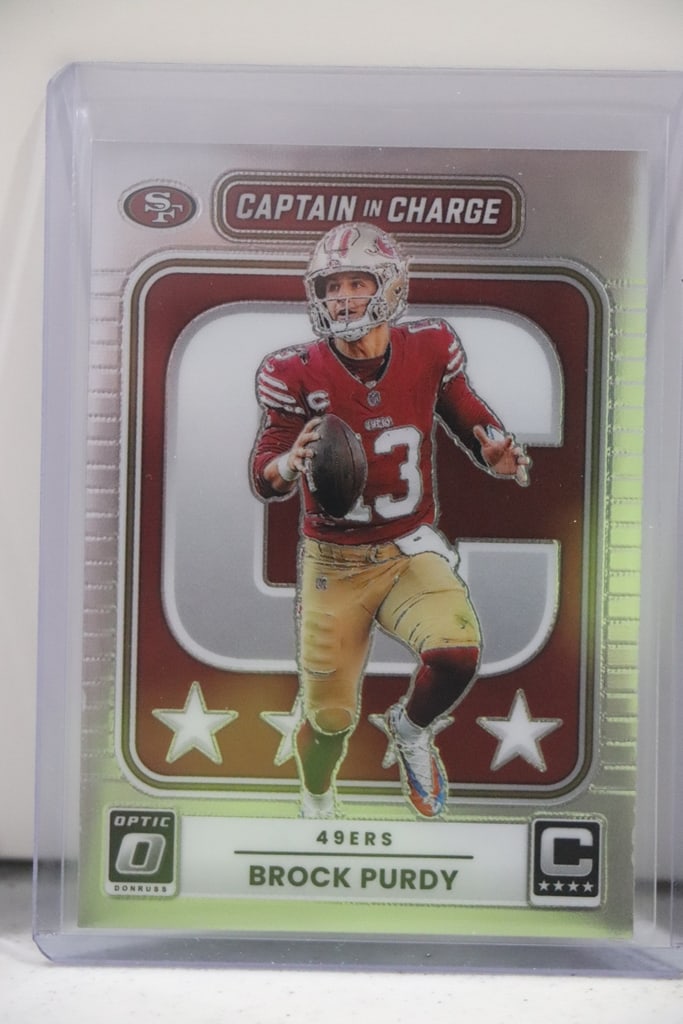 BROCK PURDY 2025 PANINI OPTIC CAPTAIN IN CHARGE INSERT: NEAR MINT OR BETTER CONDITION 