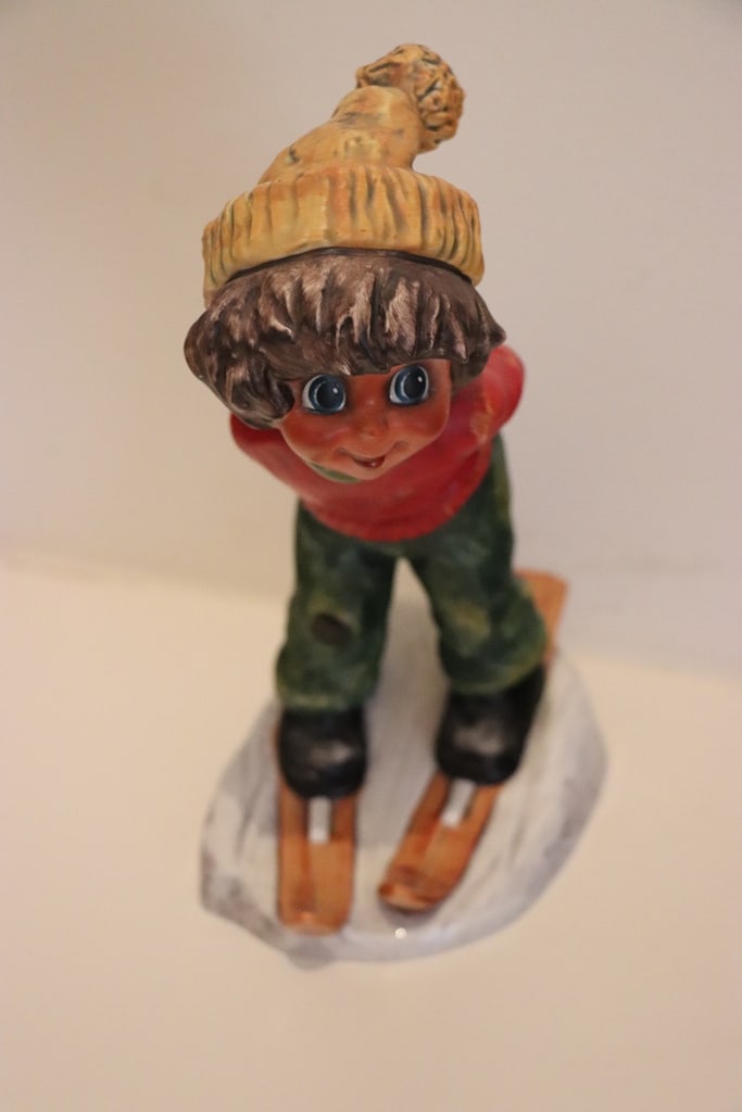 VINTAGE GOEBEL FIGURE: A VINTAGE 1971 GOEBEL FIGURE BY MICHEL THOMAS OF A BOY SKIING. 8.5". VERY GOOD CONDITION. 