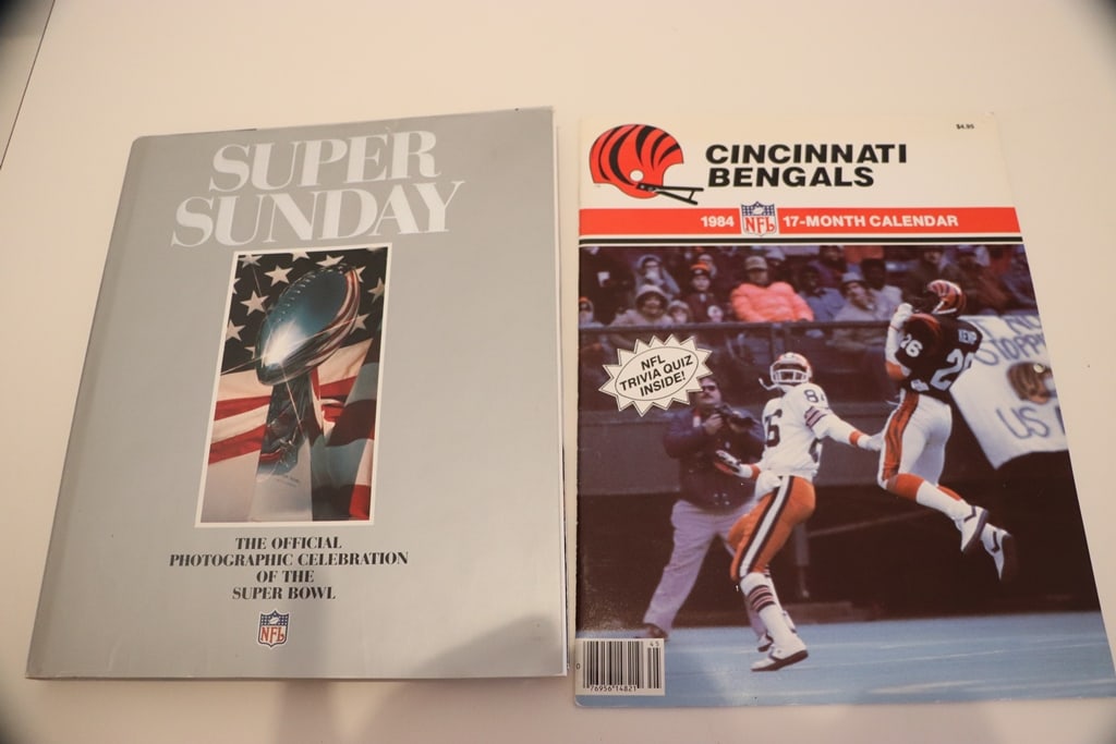SUPER BOWL BOOK: A 1983 1ST EDITION BOOK ABOUT THE SUPER BOWL GAMES FROM 1-XVII. ALSO INCLUDES A 1984 BENGALS CALENDAR. VERY GOOD CONDITION. 