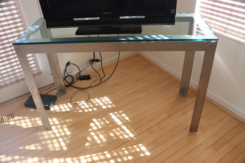 MID-CENTURY MODERN TABLE: A GLASS AND METAL MID-CENTURY MODERN SOFA TABLE. 31X48X18. VERY GOOD CONDITION.