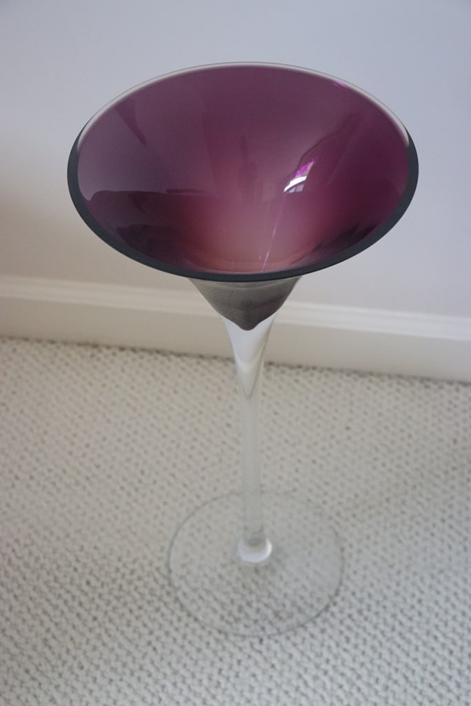 ART GLASS: AN ART GLASS DECORATIVE PURPLE AND CLEAR WINE GLASS. 20" VERY GOOD CONDITION. 