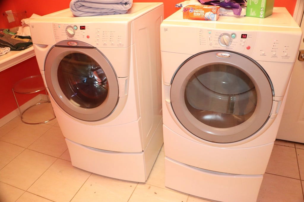 WASHER & DRYER SET: A WHIRLPOOL FRONT LOAD WASHER AND DRYER SET. POWERS UP. 