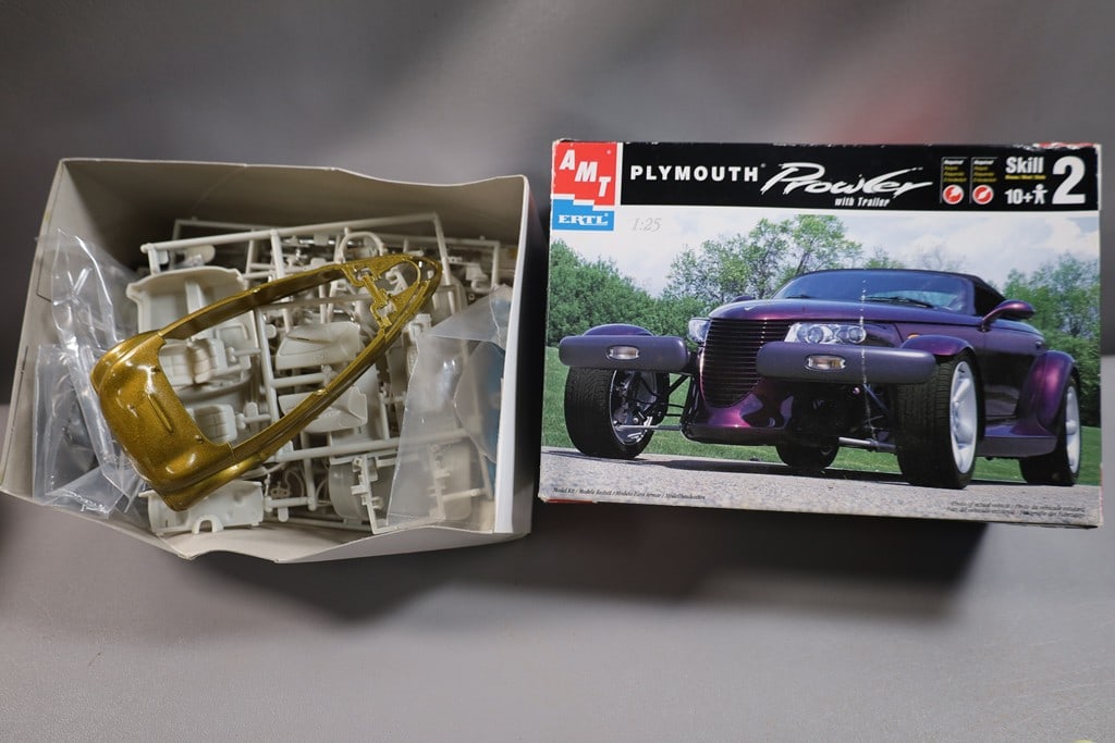 PLYMOUTH PROWLER MODEL: AN AMT MODEL KIT FOR A PLYMOUTH PROWLER. OPENED BUT NOT ASSEMBLED. 