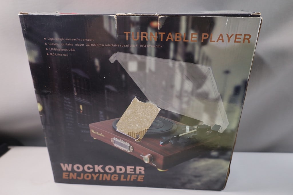 TURNTABLE RECORD PLAYER: A WOCKODER TURNTABLE RECORD PLAYER.