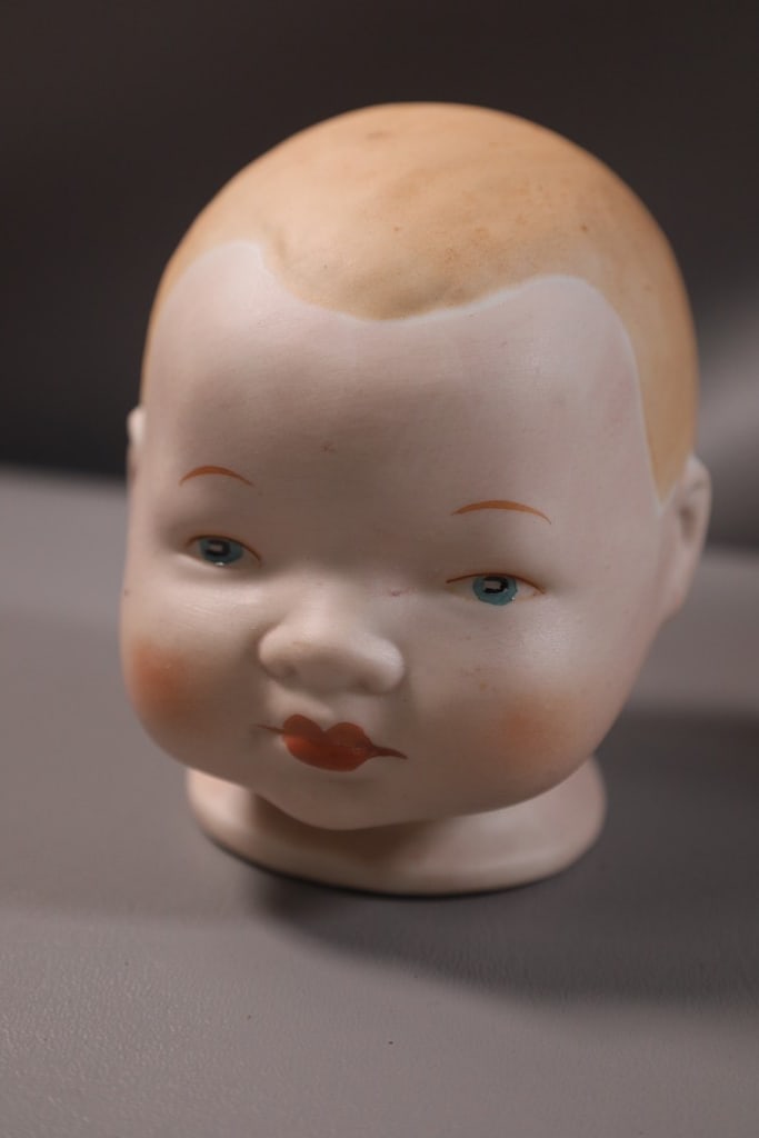 VINTAGE DOLL HEAD: A VINTAGE BRAND NEW OLD STOCK DOLL HEAD.