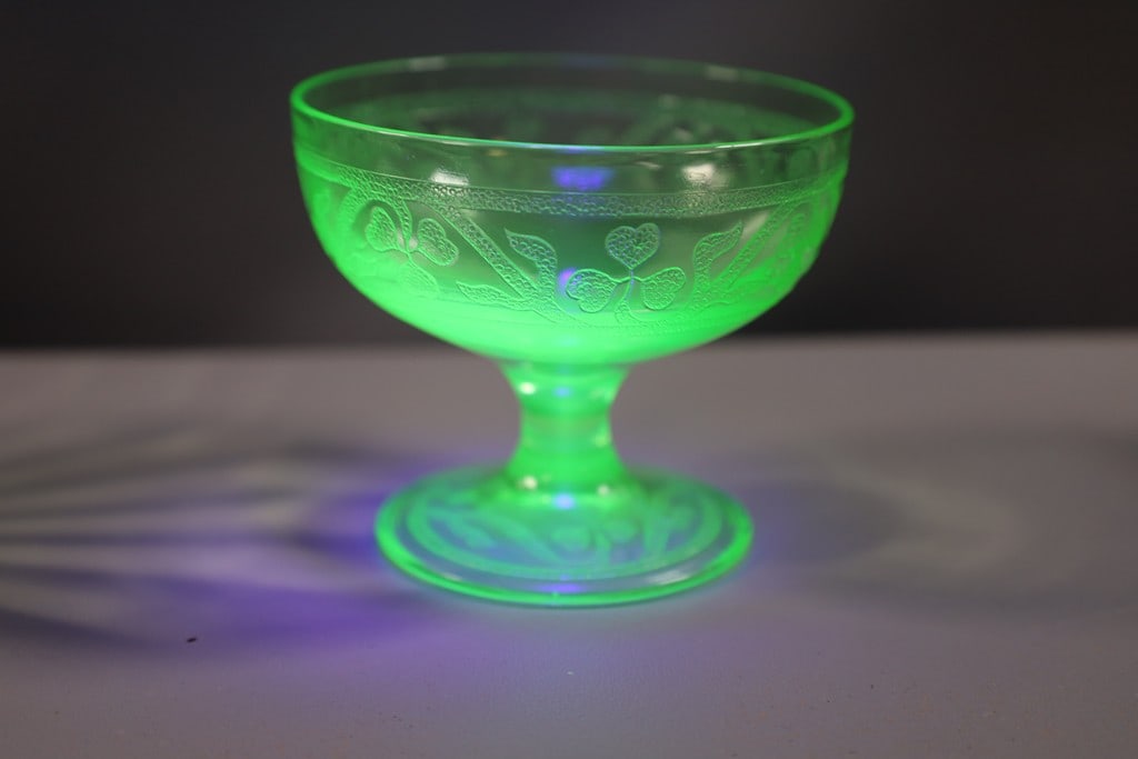 VINTAGE URANIUM GLASS: A VINTAGE URANIUM GLASS 3 LEAF CLOVER PATTERN CUP. VERY GOOD CONDITION. 