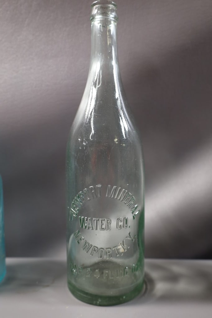 VINTAGE BOTTLE: A VINTAGE NEWPORT MINERAL WATER BOTTLE. GOOD CONDITION. 12" 