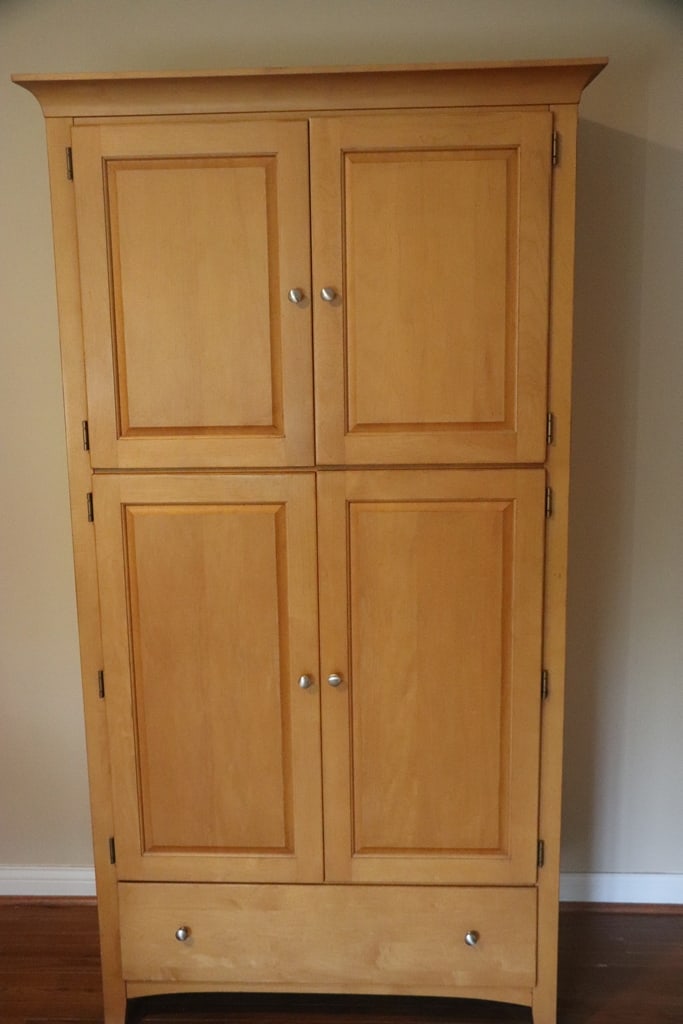 ARMOIRE: A BLOND ARMOIRE THAT MATCHES THE 4 POST BEDFRAME. WAS USED FOR LINEN STORAGE. VERY GOOD CONDITION. 