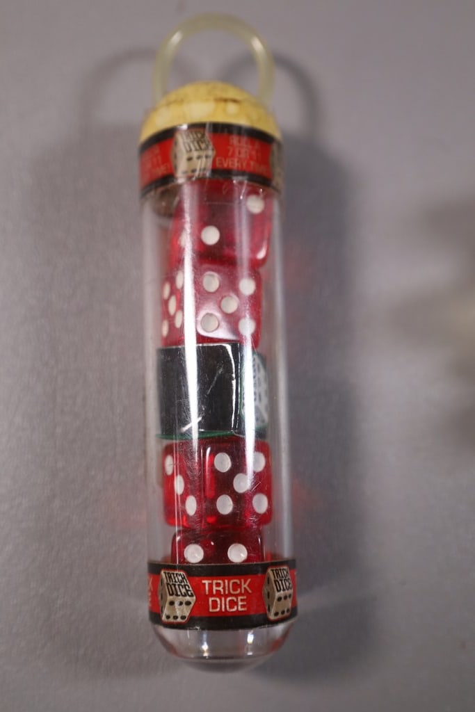 TRICK DICE: A SET OF LIKE NEW TRICK DICE. 
