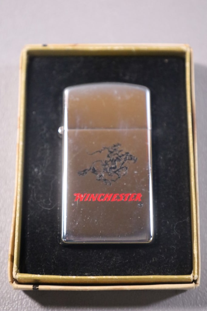 ZIPPO LIGHTER: A WINCHESTER ARMS ZIPPO LIGHTER. VERY GOOD CONDITION.