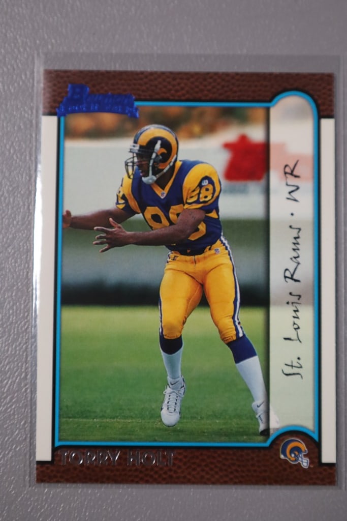 TORRY HOLT ROOKIE: A 1999 BOWMAN TORRY HOLT ROOKIE CARD. NEAR MINT OR BETTER CONDITION.