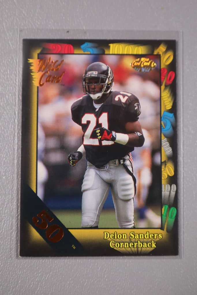 DEION SANDERS CARD: A 1991 WILD CARD 50 STRIPE PARALLEL CARD. NEAR MINT OR BETTER CONDITION.