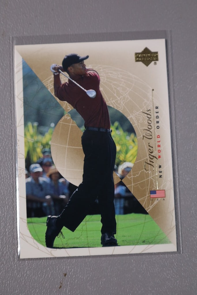 TIGER WOODS ROOKIE: A 2001 UPPER DECK NEW WORLD ORDER ROOKIE. NEAR MINT OR BETTER CONDITION.