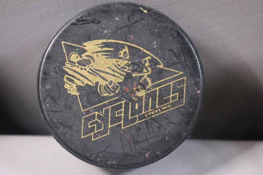 CYCLONES PUCK: A CINCINNATI CYCLONES HOCKEY PUCK.