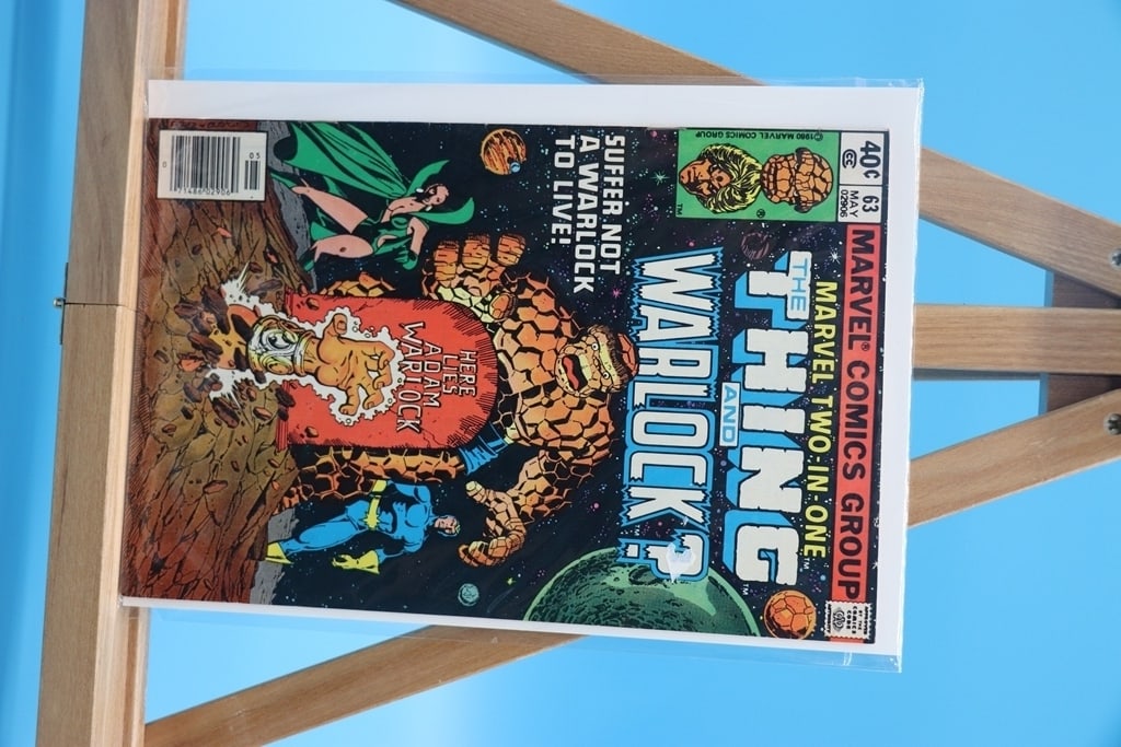 VINTAGE MARVEL COMIC: A VINTAGE MERVEL 2 IN 1 COMIC OF THE THING AND WARLOCK. GOOD CONDITION.