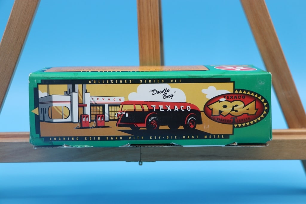 TEXACO ERTL DIE CAST: A 1994 ERTL TEXACO 1934 TANKER TRUCK DIE CAST METAL COIN BANK. BOX MAY HAVE CONDITION ISSUES BUT THE ITEM IS EXCELLENT.