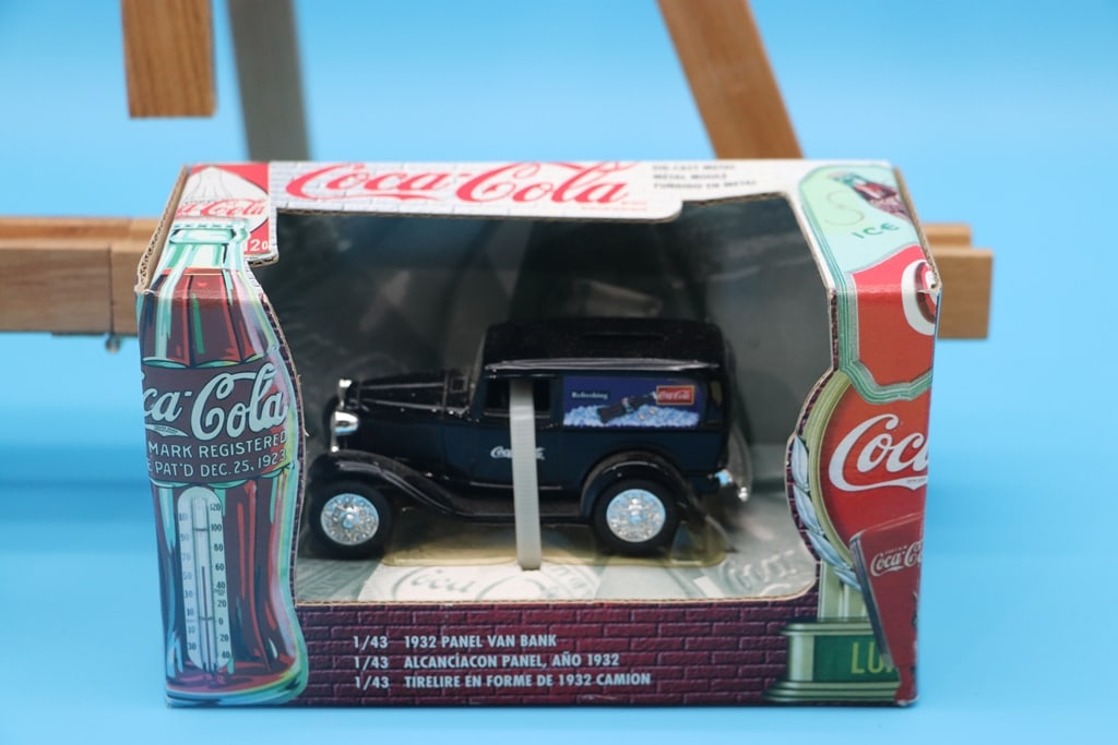 COCA COLA TRUCK: A 1/43 1932 COCA COLA BLACK FORD PANEL VAN COIN BANK DIE CAST TRUCK. BRAND NEW