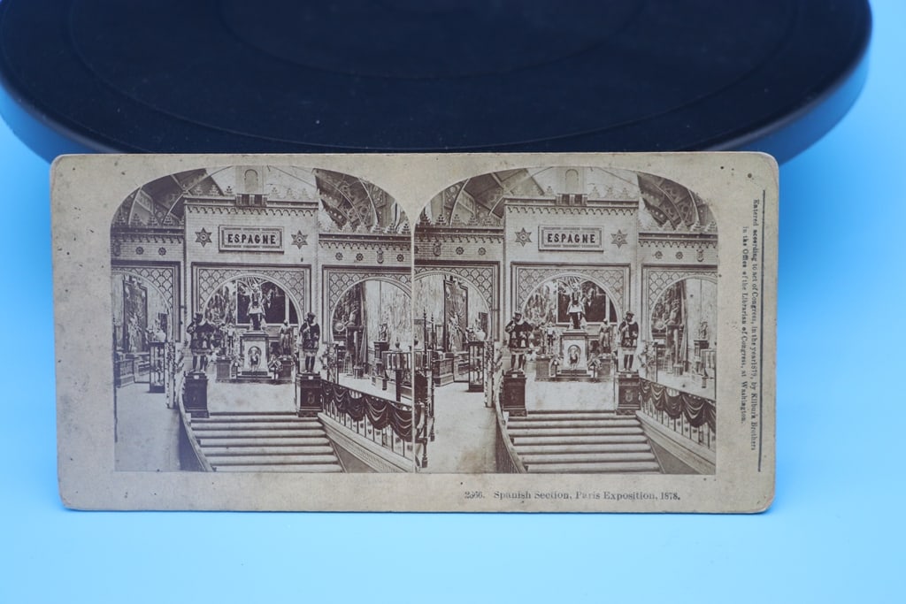 ANTIQUE STEREOSCOPE SLIDE: AN 1878 PARIS EXPOSITION STEREOSCOPE SLIDE OF THE SPANISH SCETION. GOOD CONDITION.