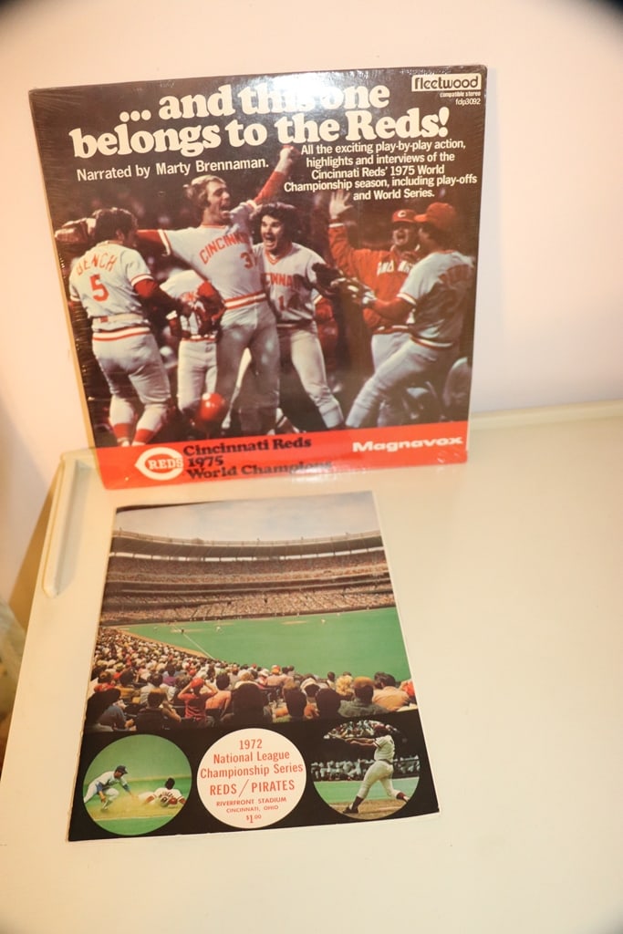 VINTAGE REDS ITEMS: A PAIR OF VINTAGE CINCINNATI REDS ITEMS WITH A 1975 WORLD CHAMPS RECORD AND A 1972 PROGRAM.
