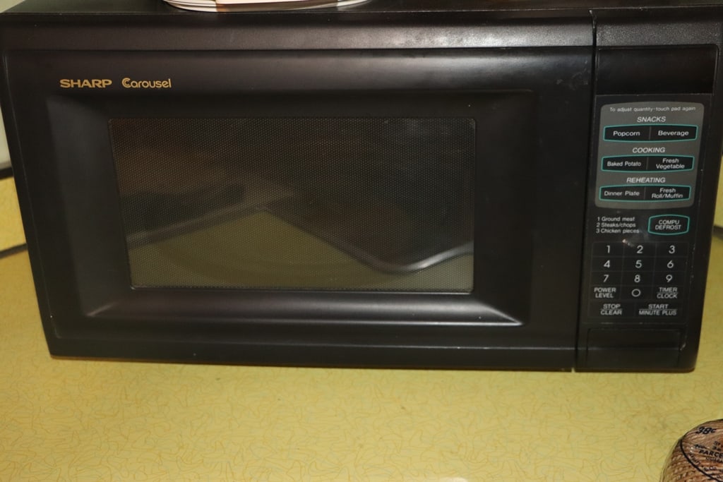 MICROWAVE: A SHARP BRAND MICROWAVE. VERY GOOD CONDITION.