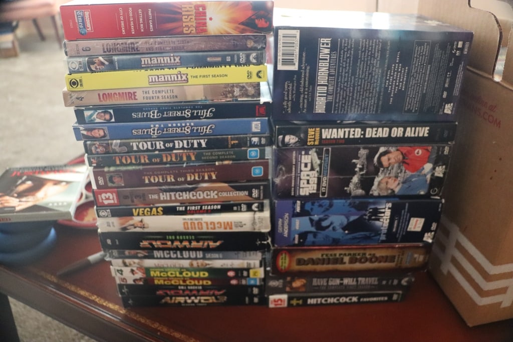DVD MOVIES: A BOX OF TV SHOW DVD'S. VERY GOOD CONDITION.