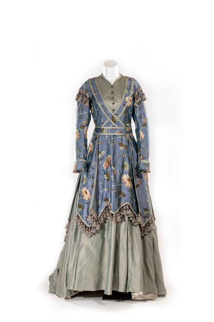 Maggie Palmer: A beautifully crafted custom 1 piece dress made by the costume department for Chelah Horsdal in her role of Maggie Plamer. It features fine detalining including floral accents throughout, a stiched be