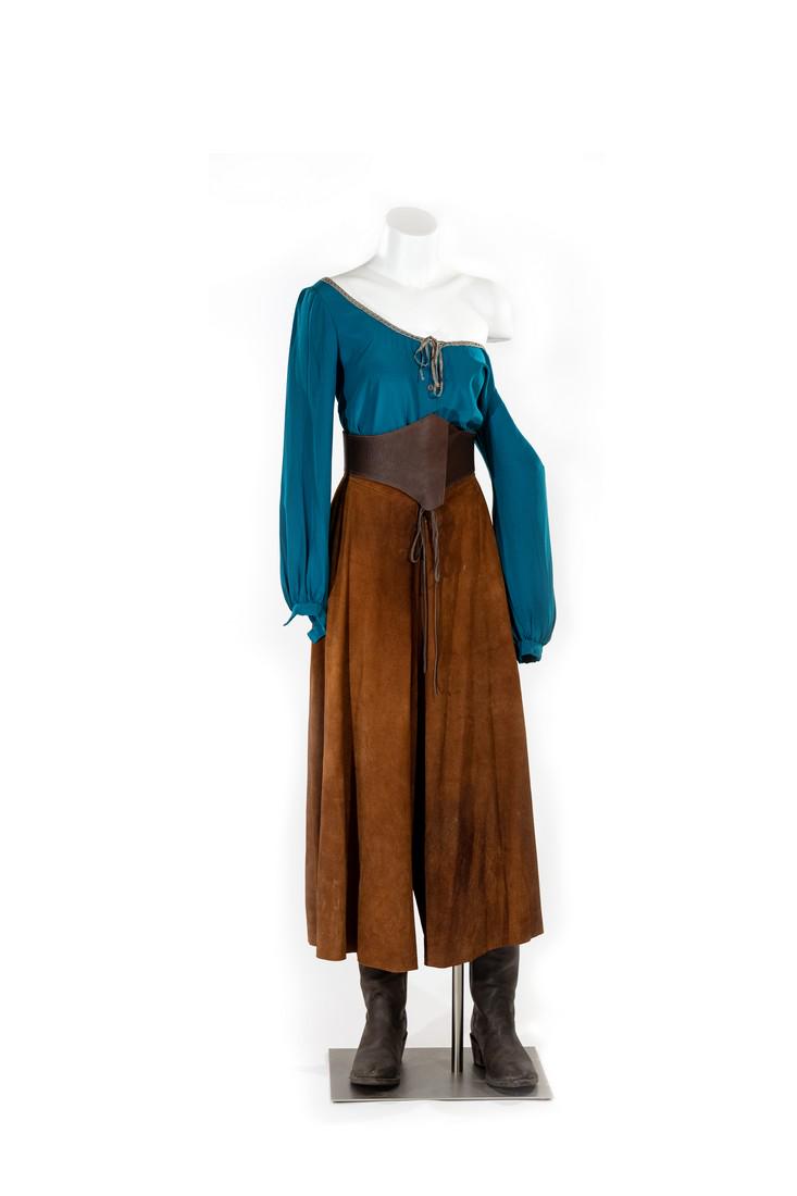 Eva: This 5 piece costume was made for Robin McLeavy in her role of Eva in the series finale. The 5 piece costume includes her leather pants/skirt, turqoise satin blouse, belts and boots. This is the last