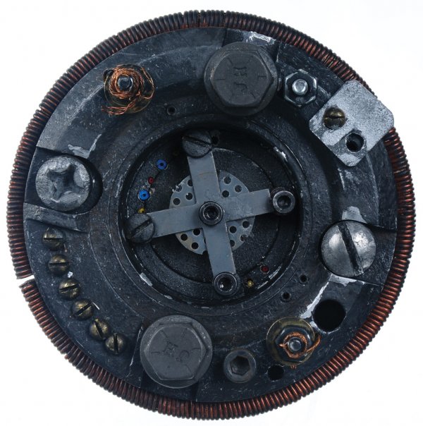 Iron Man Electro-magnet: "First chest unit seen briefly in a blurry vision as Yinsen lowers it into Tony Stark's chest. Working as an electro-magnet and powered by a car battery, Yinsen was able to save Tony Stark's life by p