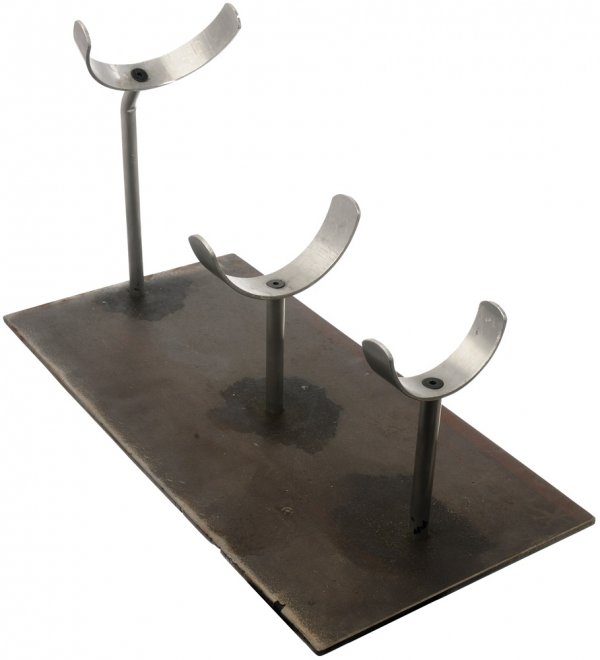 Hero Mark II Gauntlet Stand: Gauntlet stand which holds Tony Stark's arm-mounted exoskeleton stabilizer. Pepper Potts enters Tony's workshop while he is testing the arm stabilizer and watches as he gets blasted across the room. P