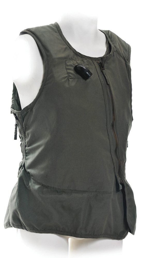 Pilot One's Hero Flight Vest and Harness: Flight Vest and parachute harness worn by "Pilot One" when he ejects from his F-22 after it is damaged from colliding with the Mark III Iron Man suit. Production noted this as the hero flight vest and
