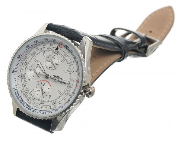 Rhodes' Screen Used Breitling Watch: Screen used Breitling wristwatch worn by Lt Colonel James Rhodes. Production labeled this as the screen used watch worn by Terrence Howard. Stainless with white face and black leather wrist band. Item