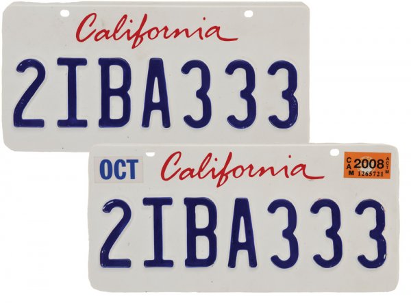 Obadiah Stane's Hero Bentley License Plates: License plates from Obadiah Stane's Bentley. Production noted these were the hero license plates from Jeff Bridges' Bentley. Weathered to look aged. Measures 12" x 6". Production wrote "STAIN BENTLEY"