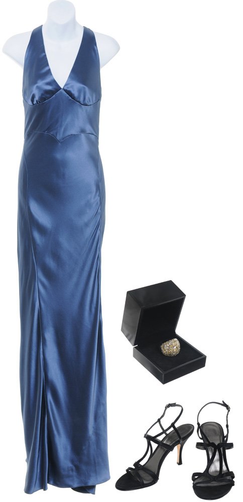Pepper Potts' Gala Dress: The cocktail dress Pepper Potts wears when attending the gala at the Disney Hall, where she first dances with Tony Stark, who attends out-of-the-blue, and surprises her. Production noted this hero out