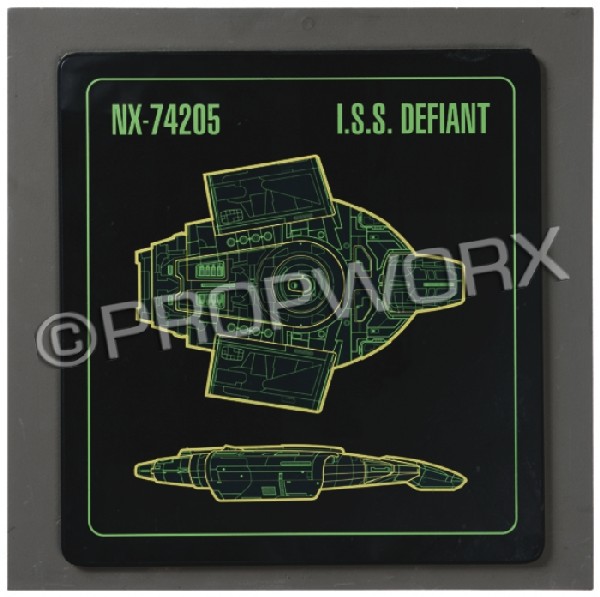 Defiant DEDICATION Plaque Cover: Plaque cover used aboard the Defiant during the filming of the Star Trek: Deep Space Nine episode "The Emperor's New Cloak." This piece was placed over the standard dedication plaque on the bridge set