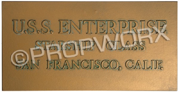 Original Series Style Enterprise Dedication Plaqu: Enterprise-D dedication plaque used during the production of the Star Trek: Deep Space Nine episode "Trials and Tribble-ations." This plaque was seen on the recreated original Enterprise bridge set. M