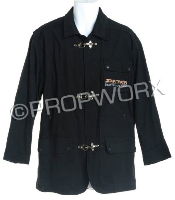 Black "Star Trek: Deep Space Nine" Crew Jacket: Black embroidered fireman's-style jacket given to the cast and crew of Star Trek: Deep Space Nine. Size extra small with three hook style closures constructed of cotton with satin black liner folded i