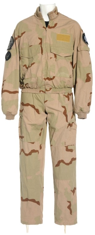 Mitchell's Tan Camo BDU from Season Nine: Production Description: Tan camouflage uniform worn by actor Ben Browder as "Cameron Mitchell" on Stargate SG-1. Mitchell led the SG-1 team through the last two years of the series after recovering fr