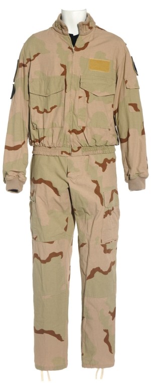 Mitchell's Tan Camo Uniform from Season Nine: Production Description: Tan camouflage uniform worn by actor Ben Browder as "Cameron Mitchell" on Stargate SG-1. Mitchell led the SG-1 team through the last two years of the series after recovering fr